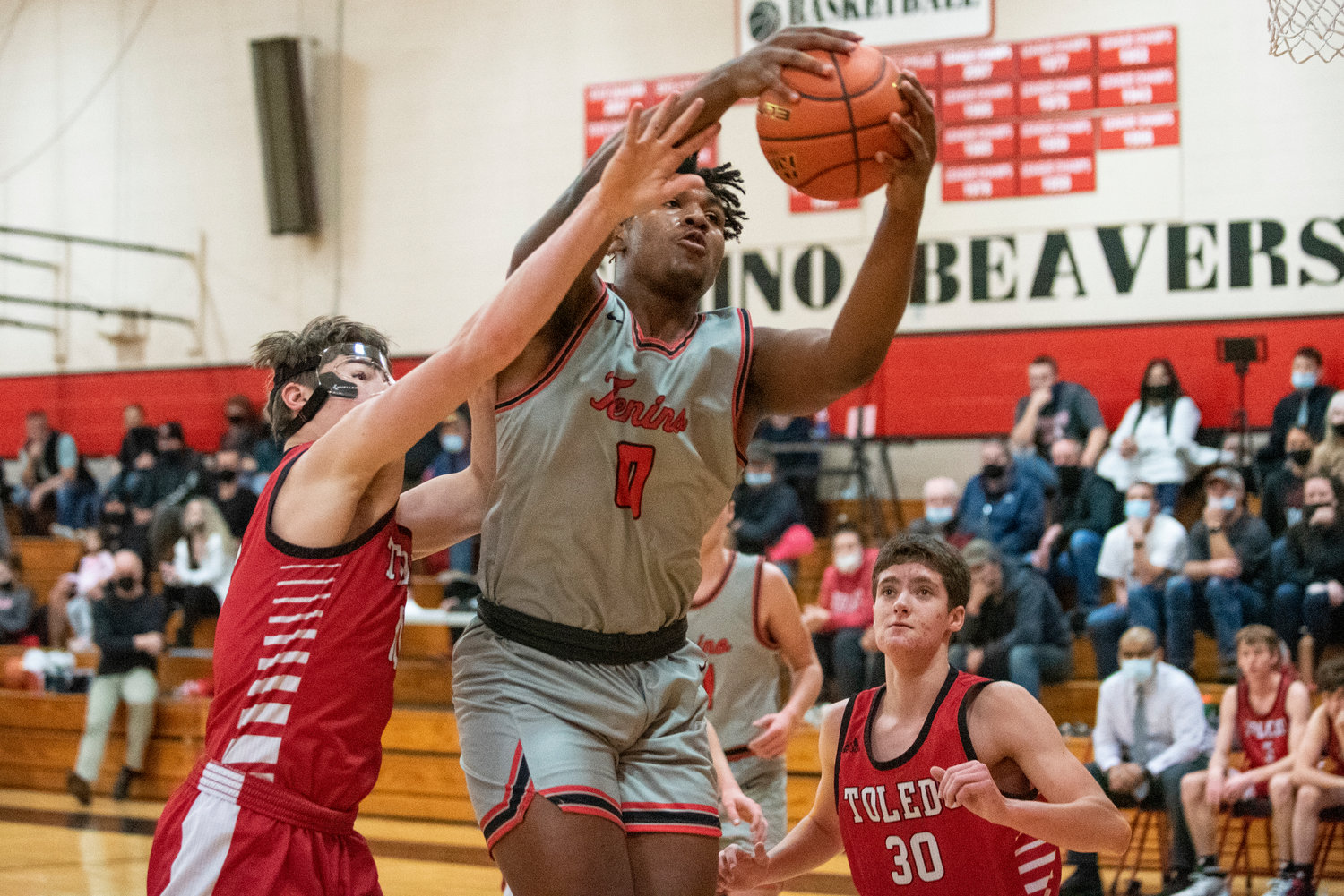 Tenino's Takari Hickle receives a pass in the paint during a home game against Toledo on Dec. 22.
