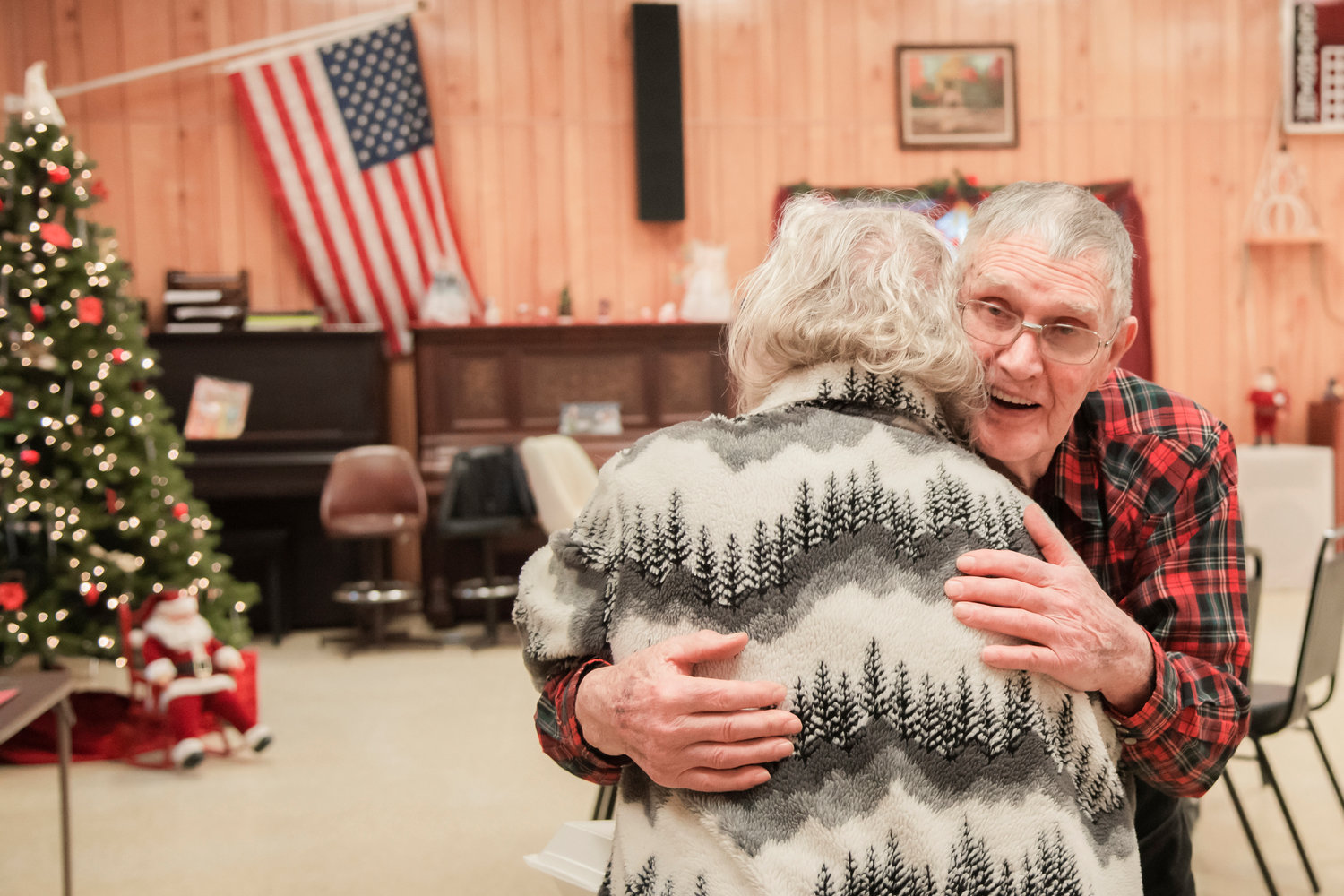 Don Rich receives an embrace during a visit to the Morton Senior Center Wednesday afternoon.