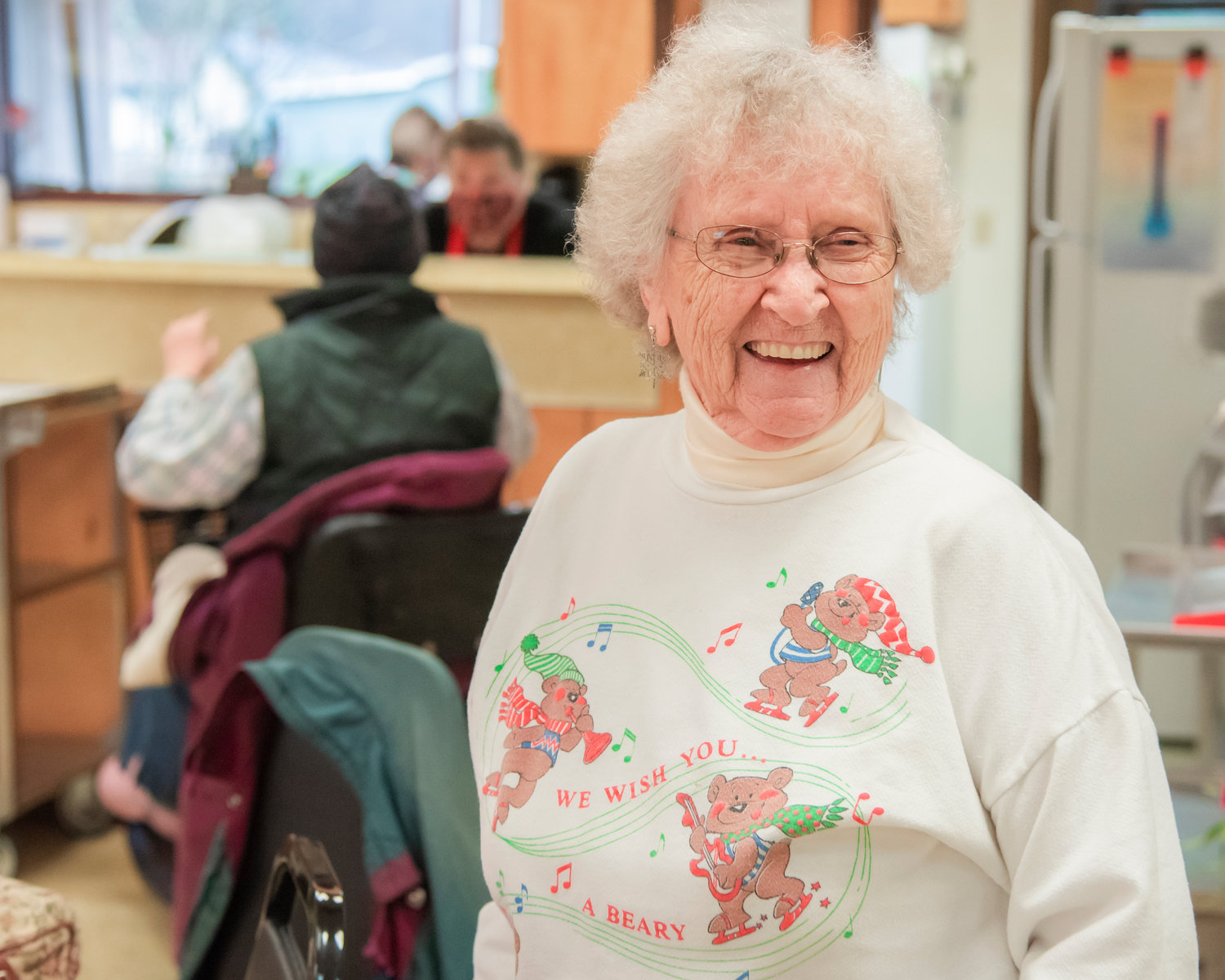 Louise Wood smiles while describing her first visit to the Morton Senior Center Wednesday afternoon as lunch is served.