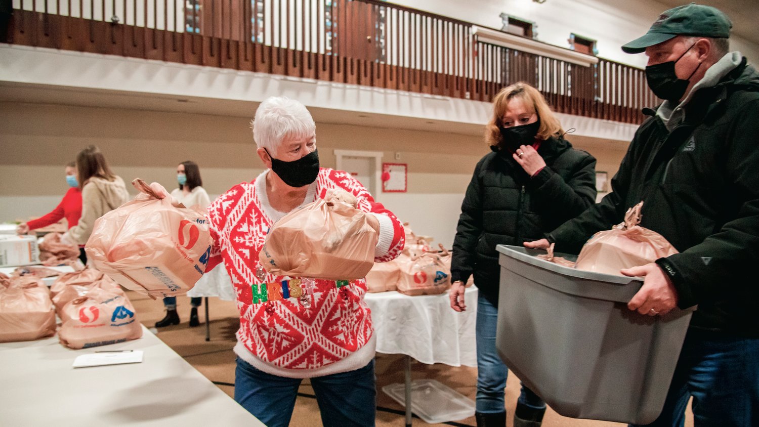 A hot meal is prepared during a drive-through Christmas dinner hosted at the Centralia Community Church of God Saturday afternoon.