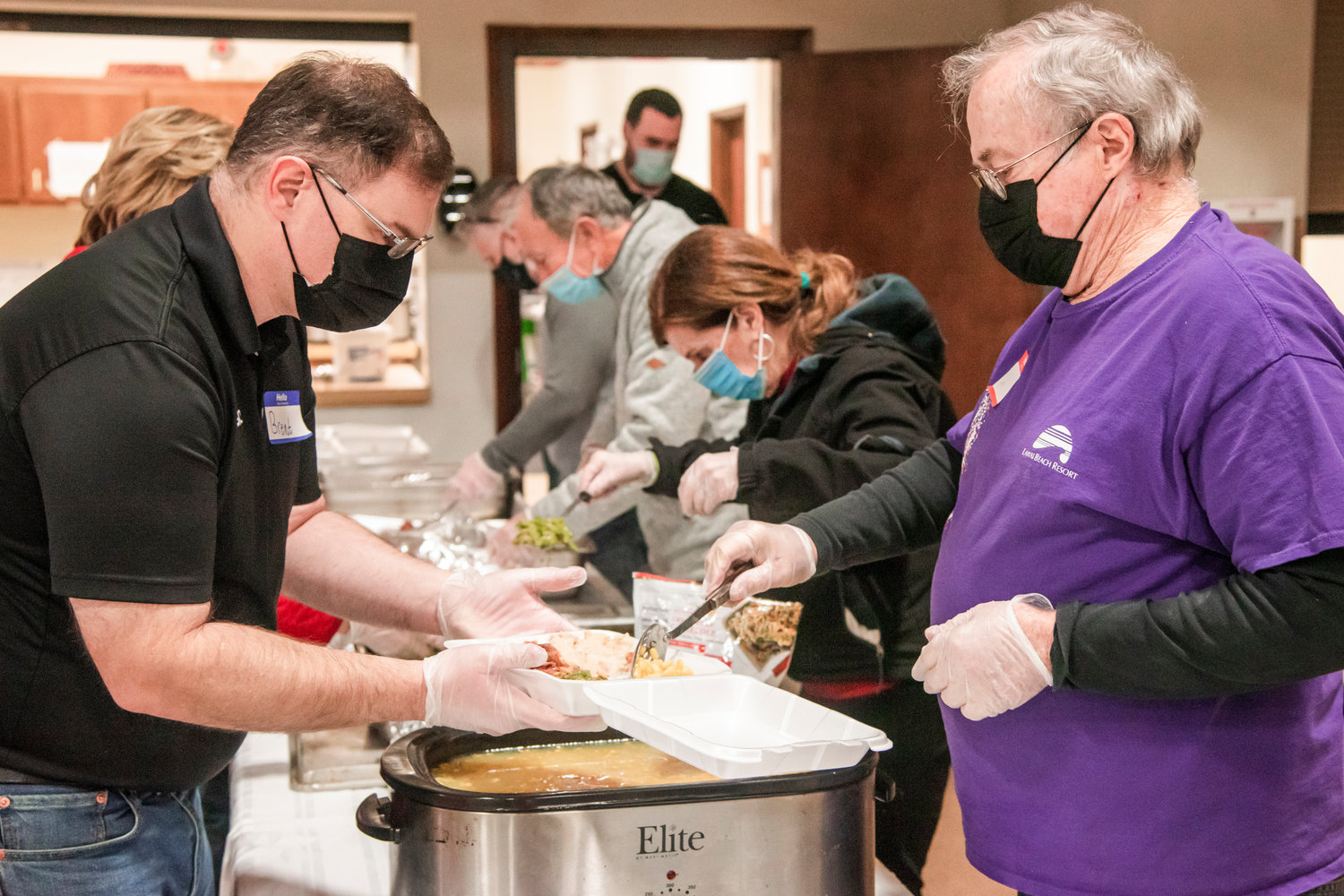 Volunteers prepare hot meals at the Centralia Community Church of God on Christmas Saturday afternoon.