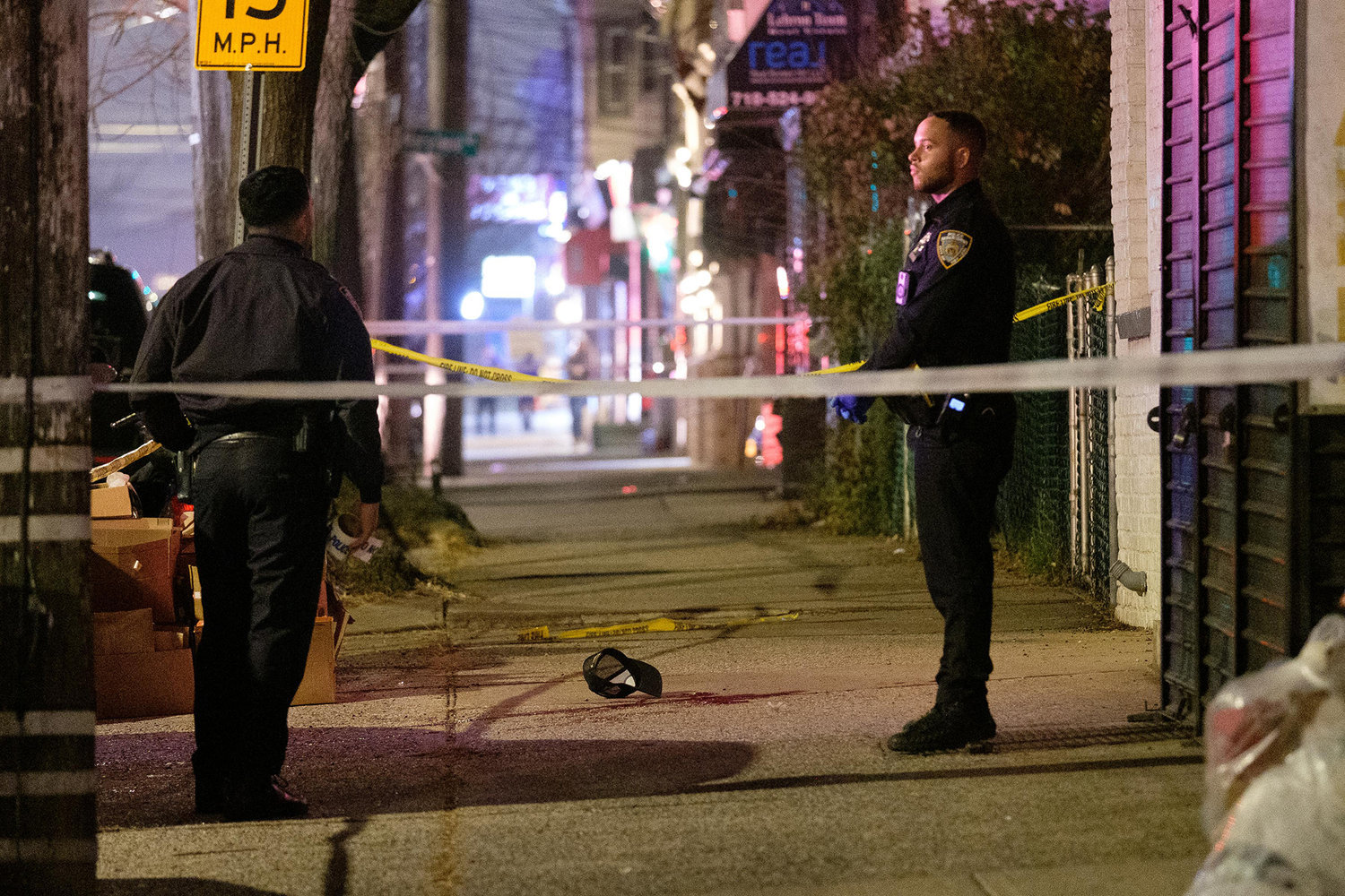 Police investigate the fatal shooting on Bay Street in Staten Island Friday. (Gardiner Anderson/New York Daily News/TNS)