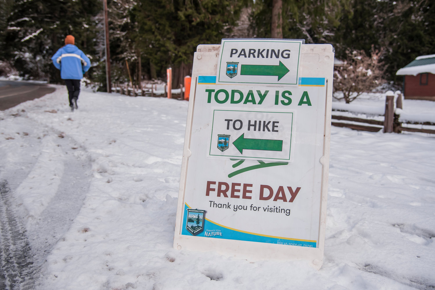 Signage sits at the parking area for first day hikes at Lewis and Clark State Park on Saturday.