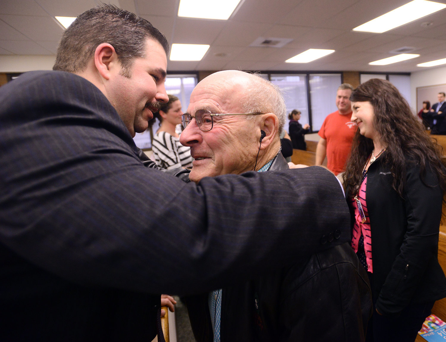 Former Lewis County Sheriff's Detective Bruce Kimsey, left, hugs Dennis Hadaller after a jury found Rick Riffe guilty of double homicide in Lewis County Superior Court in 2013 at the Lewis County Law and Justice Center in Chehalis. Hadaller was the son of Minnie Maurin, who, along with her husband, Ed, were murdered by Riffe in December of 1985.