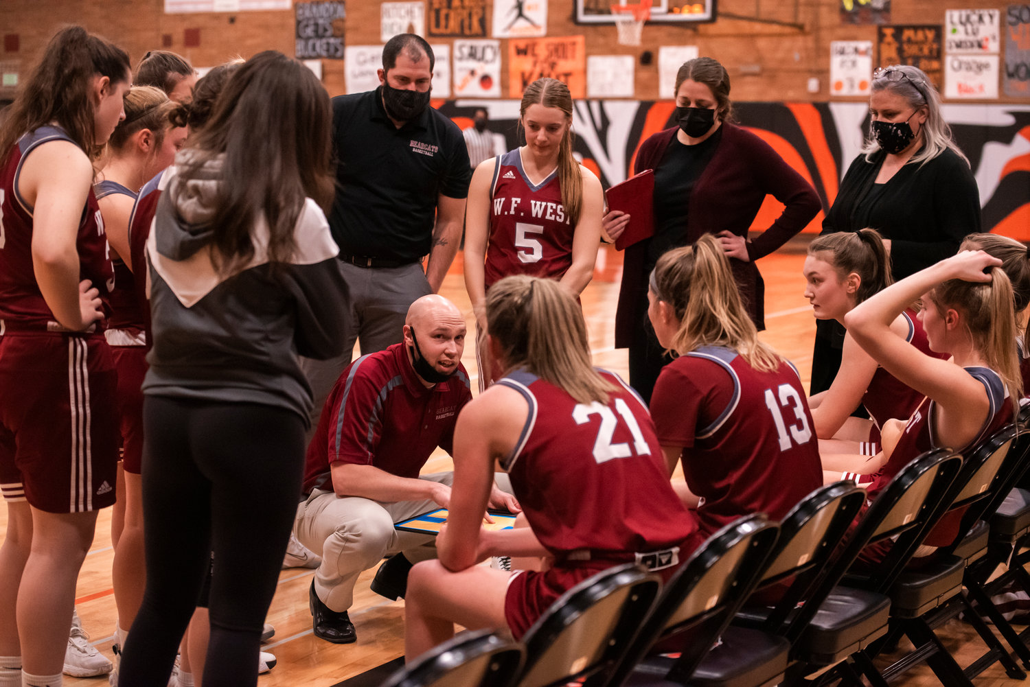W.F. West Girls Basketball Head Coach Kyle Karnofski talks with players Tuesday night during a Swamp Cup rivalry game in Centralia.