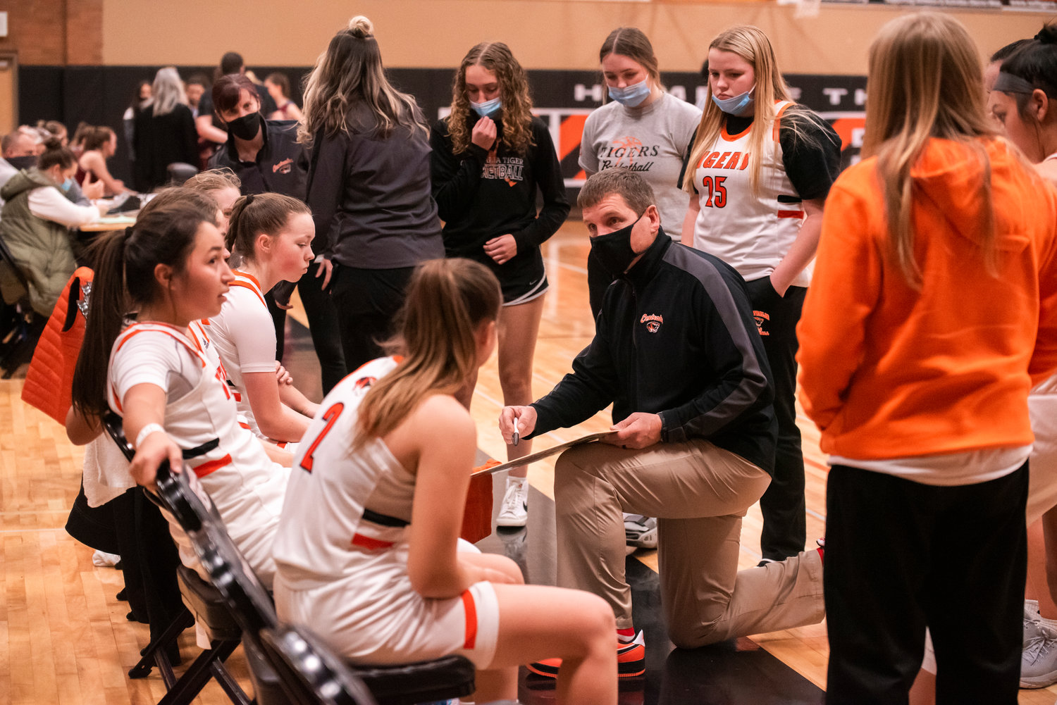 Centralia Girls Basketball Head Coach Doug Ashmore  talks with Athletes Tuesday night during a game against W.F. West.