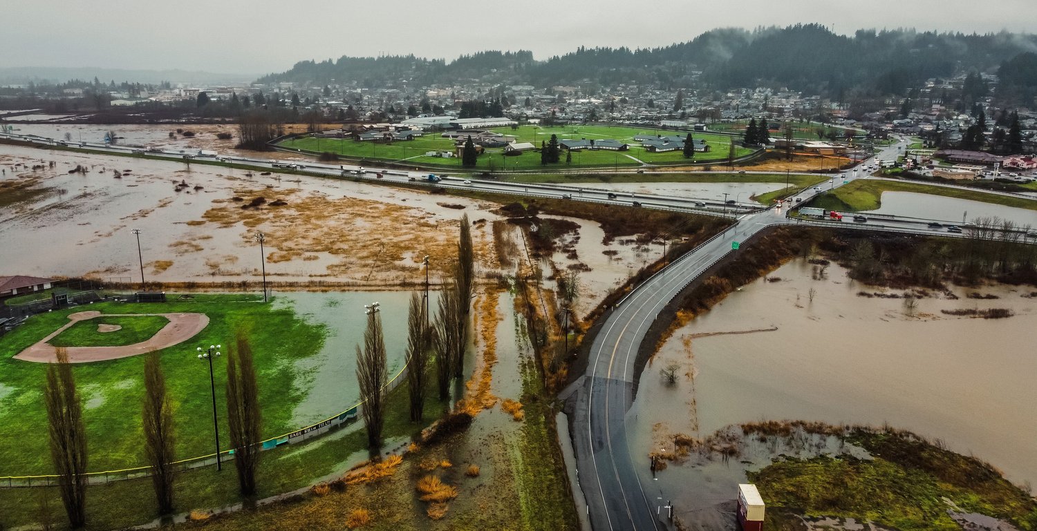 Flooding from the Newaukum River inundates fields and roads near Stan Hedwall Park Thursday, January 6, 2022 in Chehalis near Interstate 5 at milepost 76.