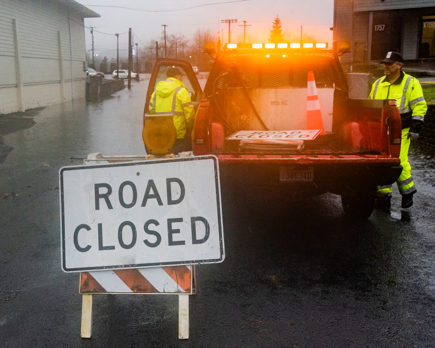 Centralia Public Works crews set out cones and signs to block roadways on Thursday as flood waters continue to rise.