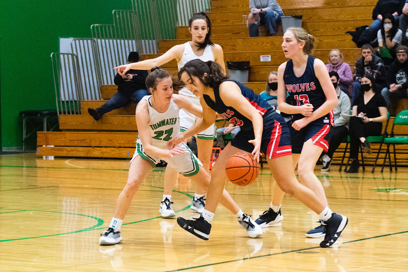 Tumwater's Regan Brewer (22) defends against a Black Hills player on Thursday.