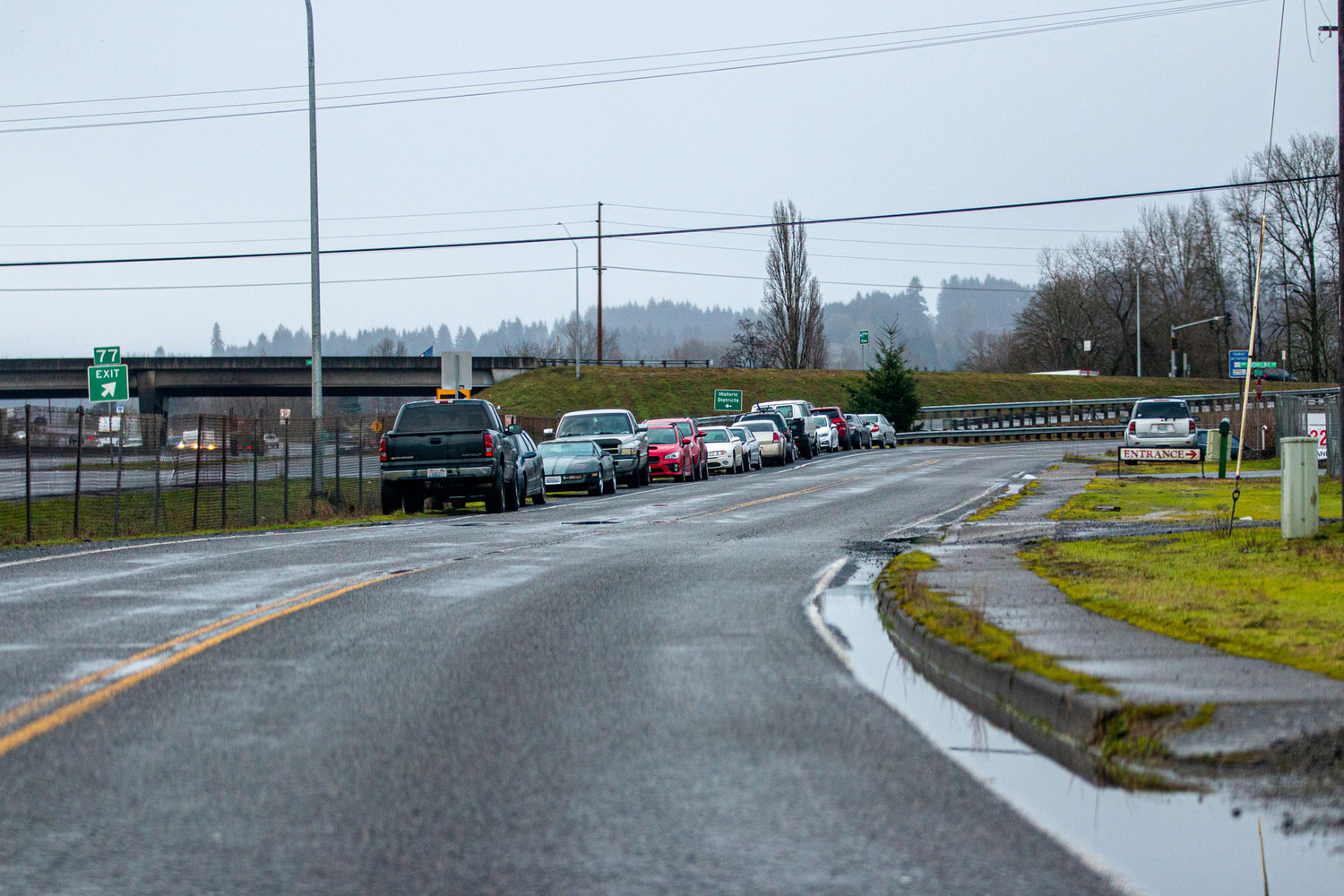 Vehicles lined up on SW Riverside Drive due to flooding onto NW Shoreline Drive from the Chehalis River.