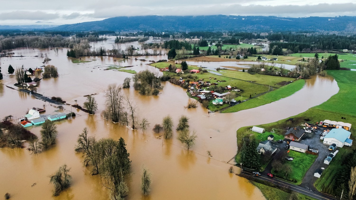 The Chehalis River overflows into Scatter Creek inundating Independence Road and nearby properties in Rochester in January 2022.