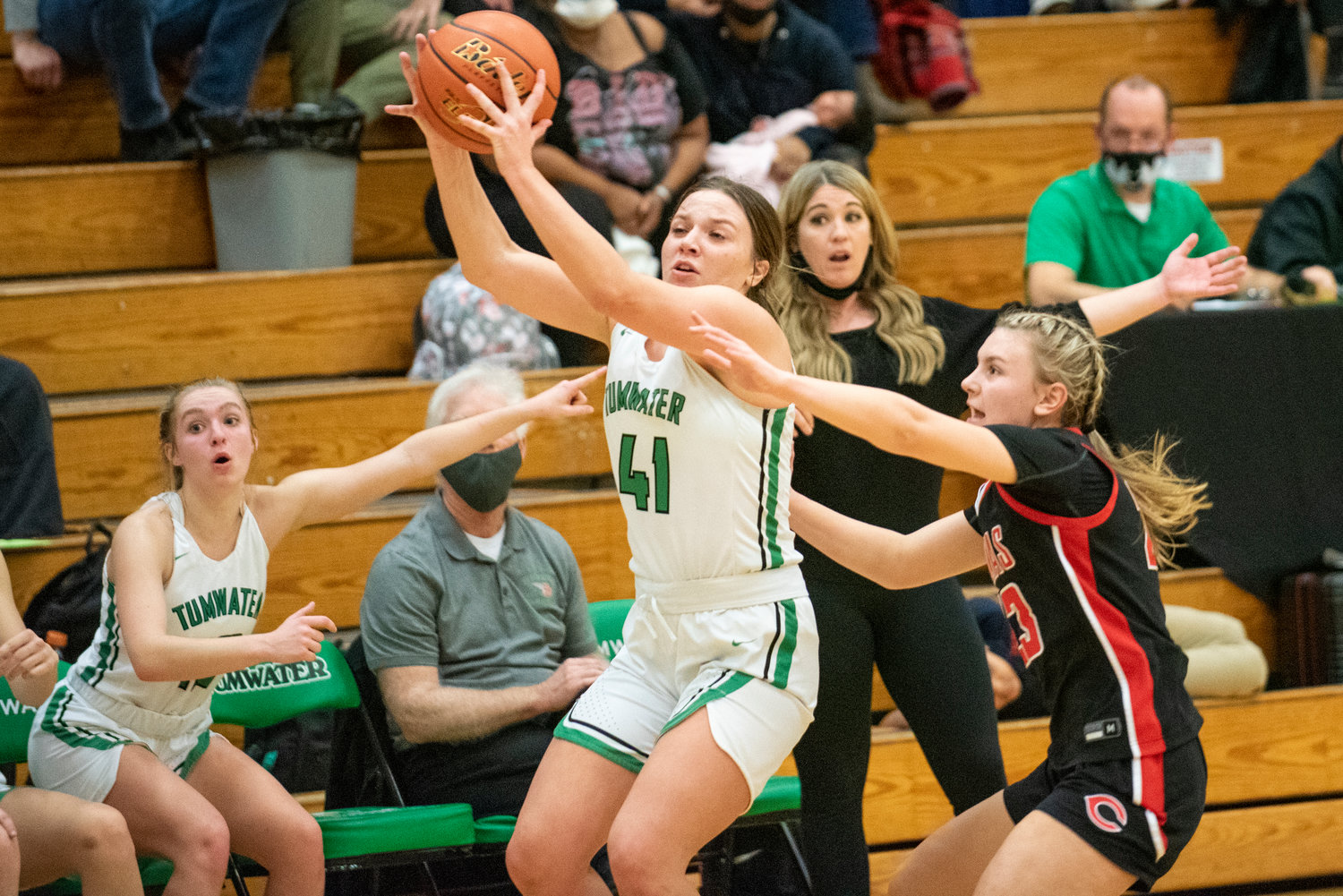 Tumwater's Cassie Kaufman (41) hauls in an inbound pass against during a non-league home game against Camas on Jan. 10.