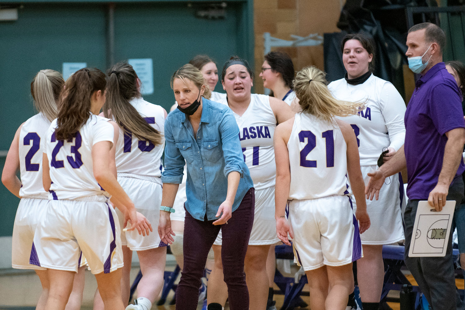Onalaska coach Alana Olson greets her players during a timeout against Adna on Jan. 11.