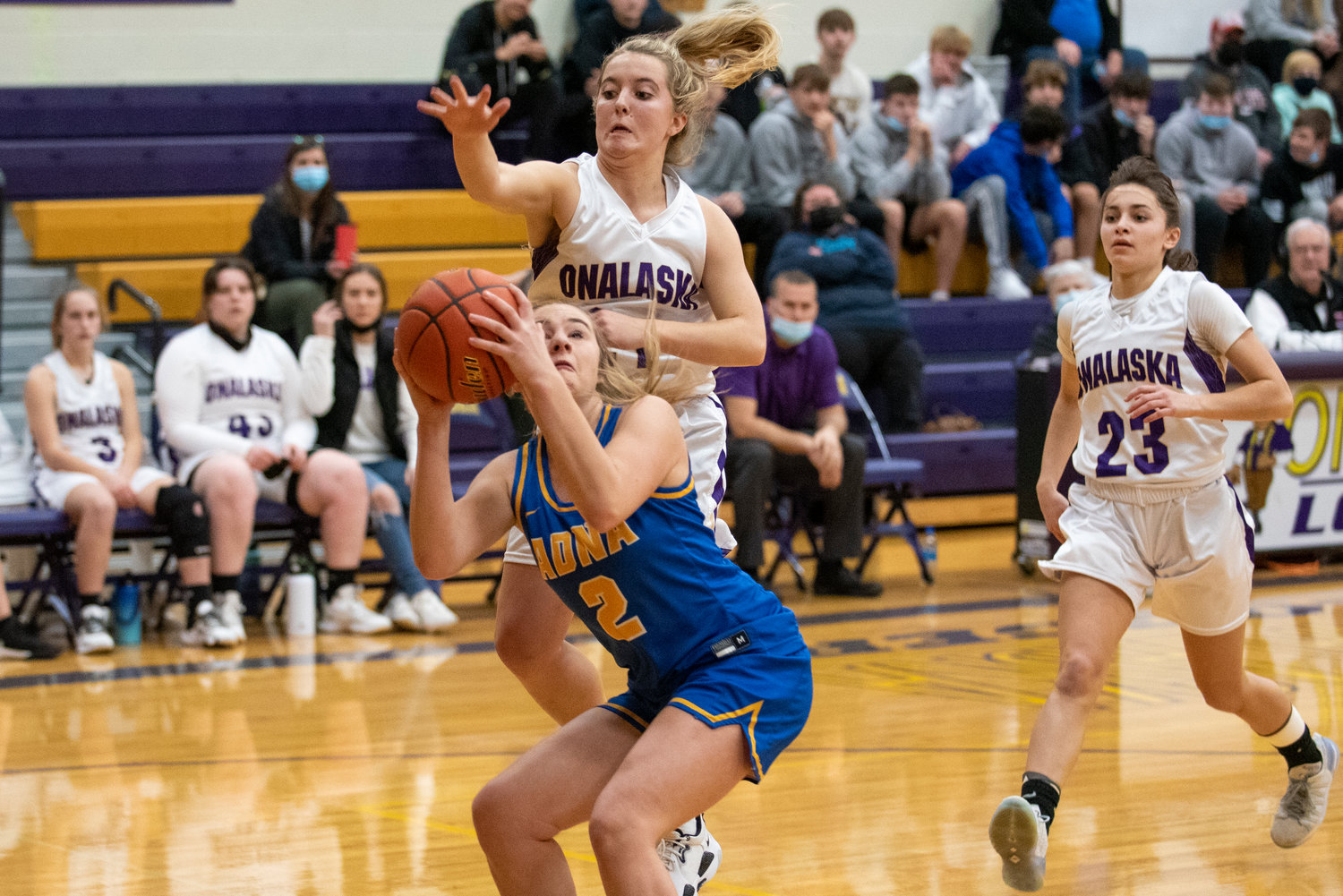 Adna's Summer White (2) looks for an open shot under the hoop as Onalaska's Callie Lawrence (21) defends on Jan. 11.