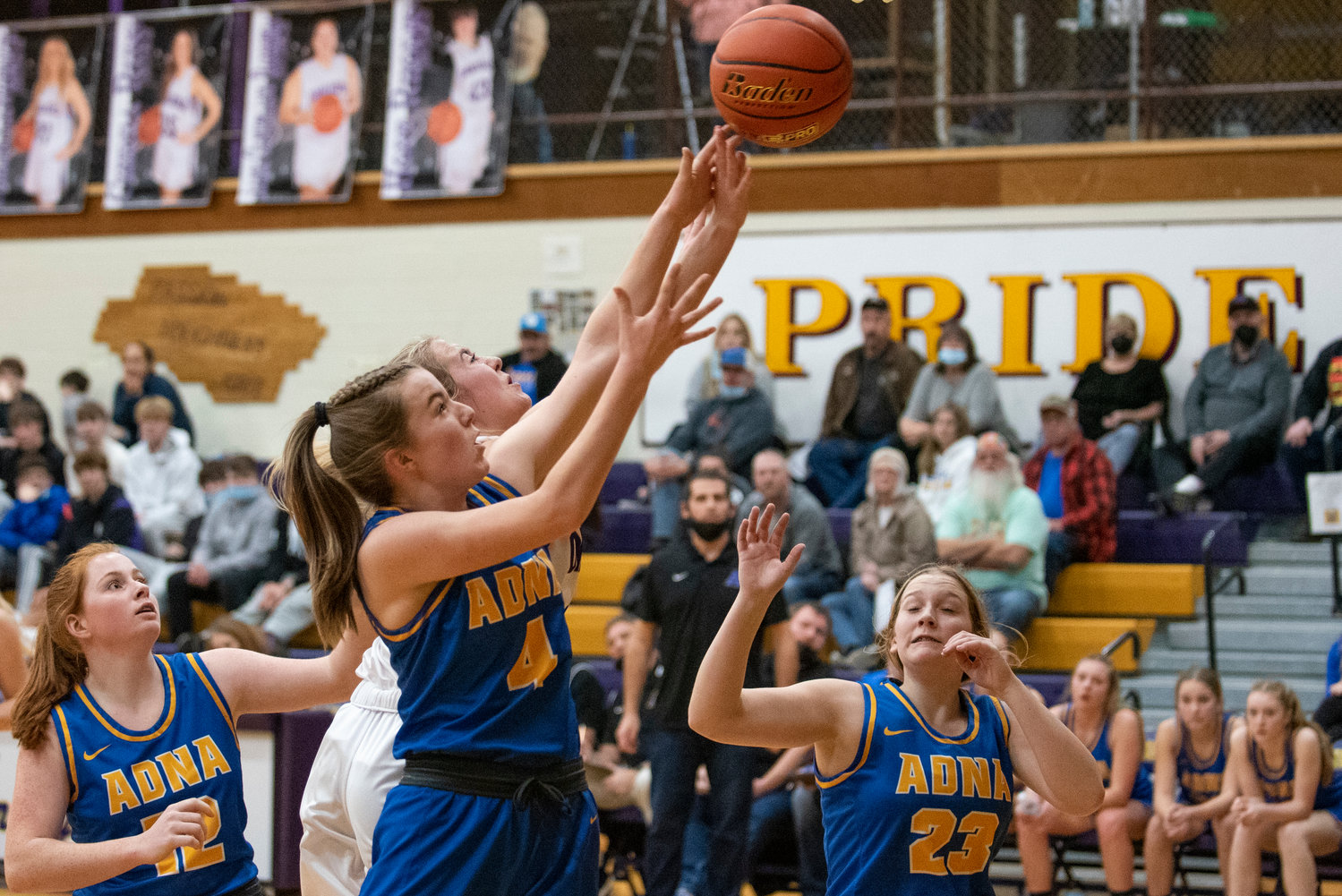 Adna's Brooklyn Loose (4) and Onalaska's Callie Lawrence battle for a rebound on Jan. 11.