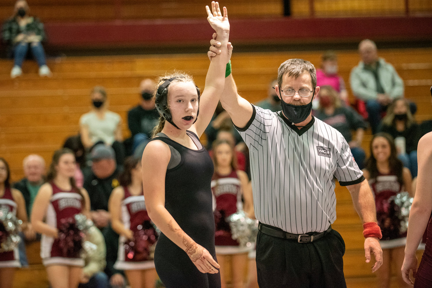 Adna's Lilly Wellander raises her hand in victory after defeating W.F. West's Brooke Johnston in Chehalis on Jan. 12.