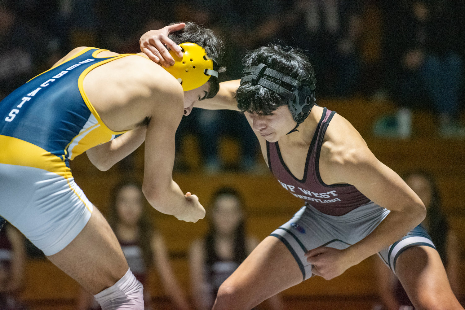W.F. West's Damian Hernandez ties up with an Aberdeen wrestler during a home dual match on Jan. 12.