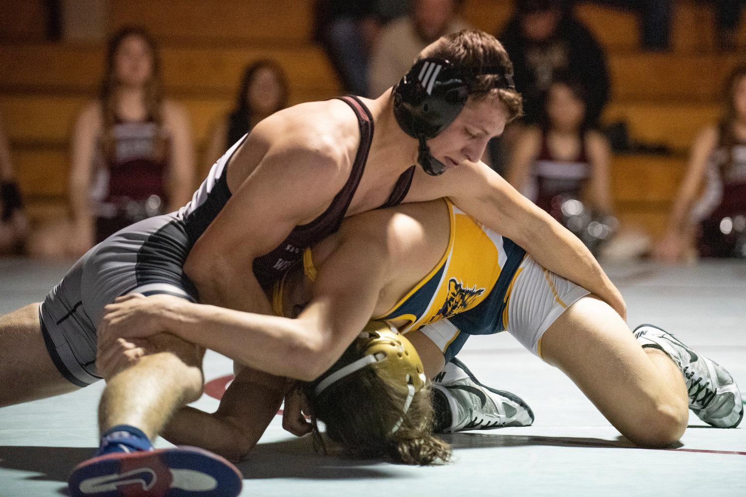 W.F. West's Blake Ely, top, grapples with an Aberdeen wrestler during a home dual match on Jan. 12.