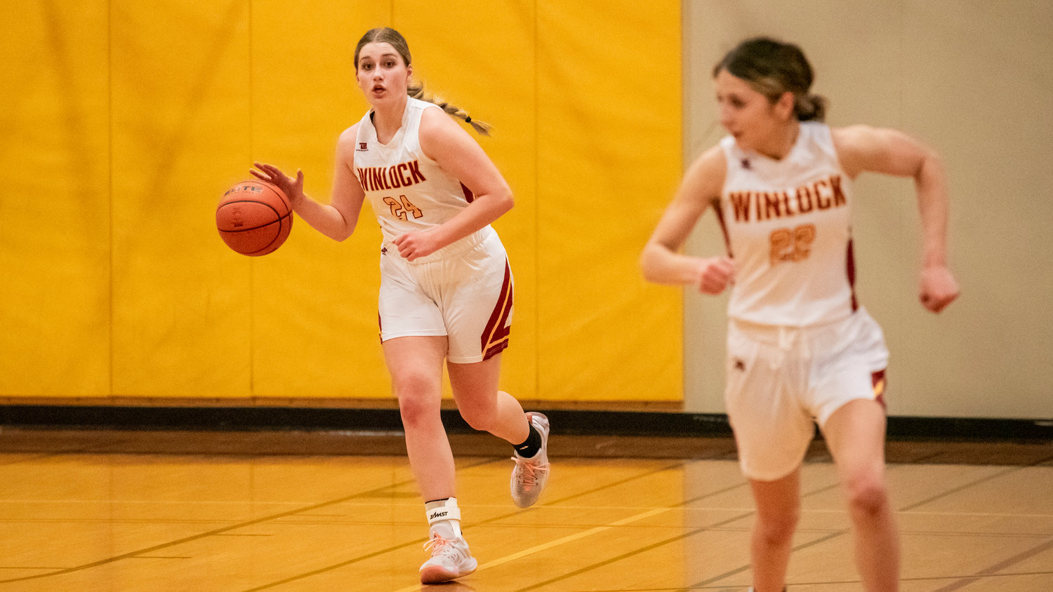 Winlock’s Addison Hall (24) brings the ball up court Thursday night during a game.