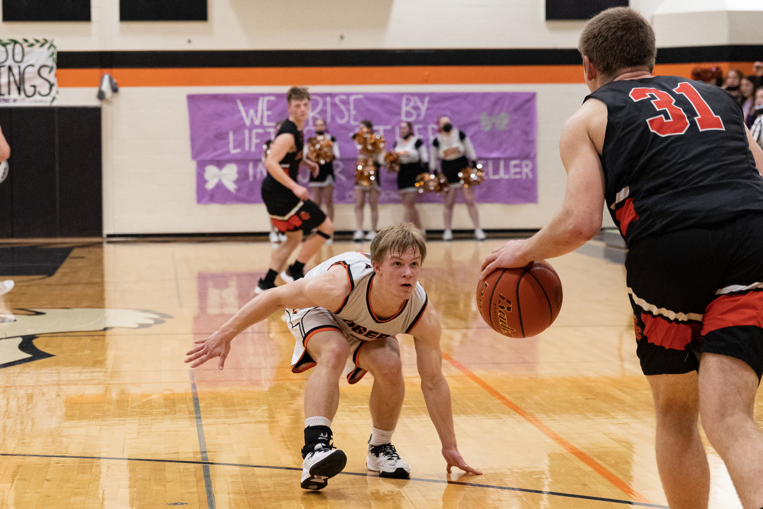 Cael Stanley gets low in his stance guarding Kalama's Jackson Esary Jan. 14.