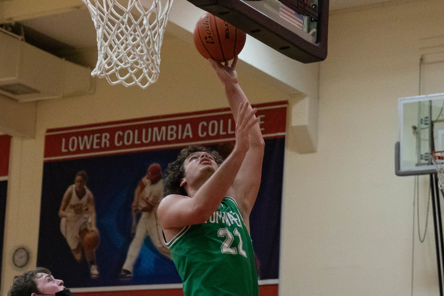 Tumwater forward Ryan Otton makes a layup against Mark Morris at the MLK Tribute in Longview at Lower Columbia Community College Jan. 17.