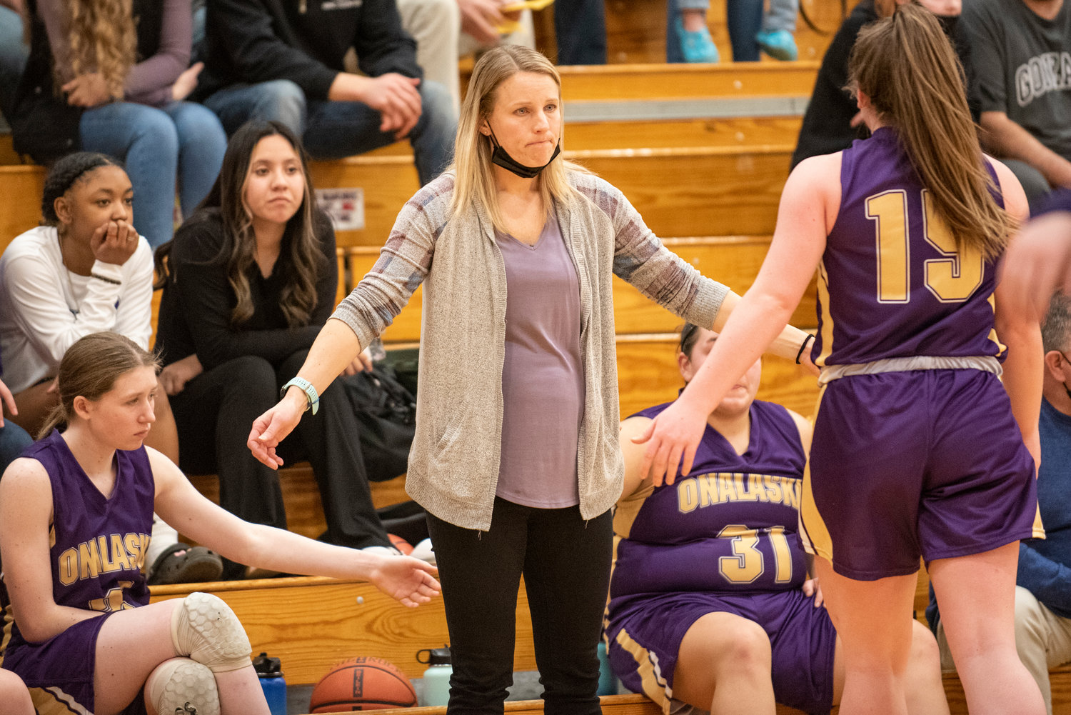 Onalaska girls basketball coach Alana Olson welcomes Dakota Hamilton to the bench on Jan. 18.