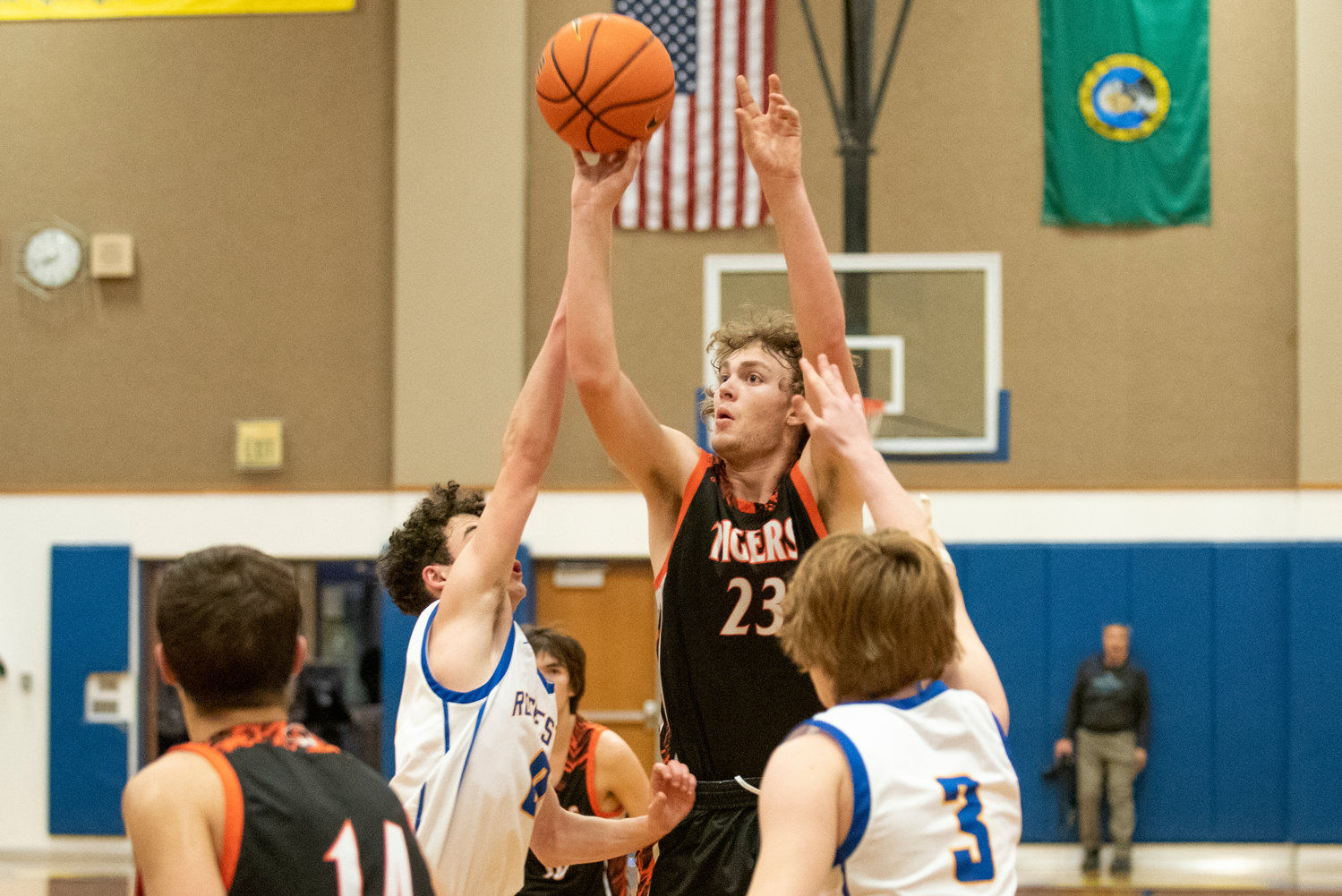 Centralia's Cole Wasson (23) shoots a contested 3-pointer against Rochester on Jan. 19.