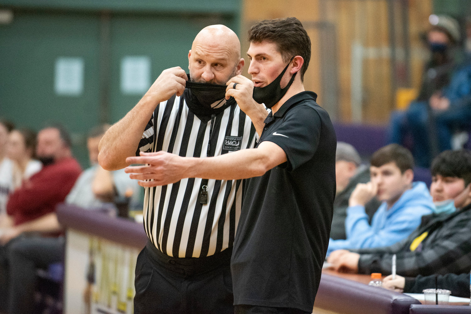 Rainier coach Brandon Eygabroad talks with an official during a road game at Onalaska on Jan. 20..