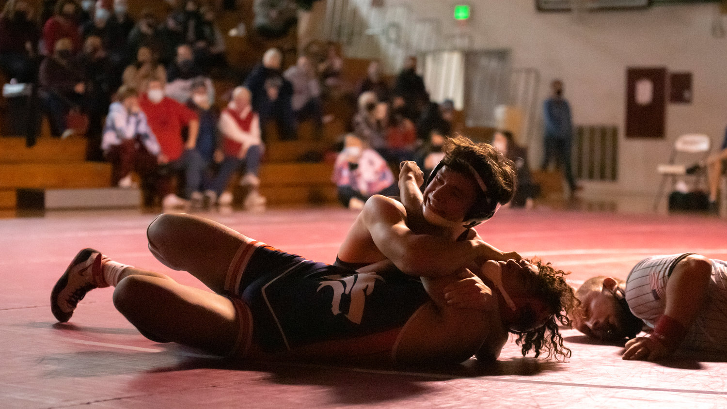 W.F. West’s Cristo Parriott smiles as he pins his opponent Thursday night in Chehalis.