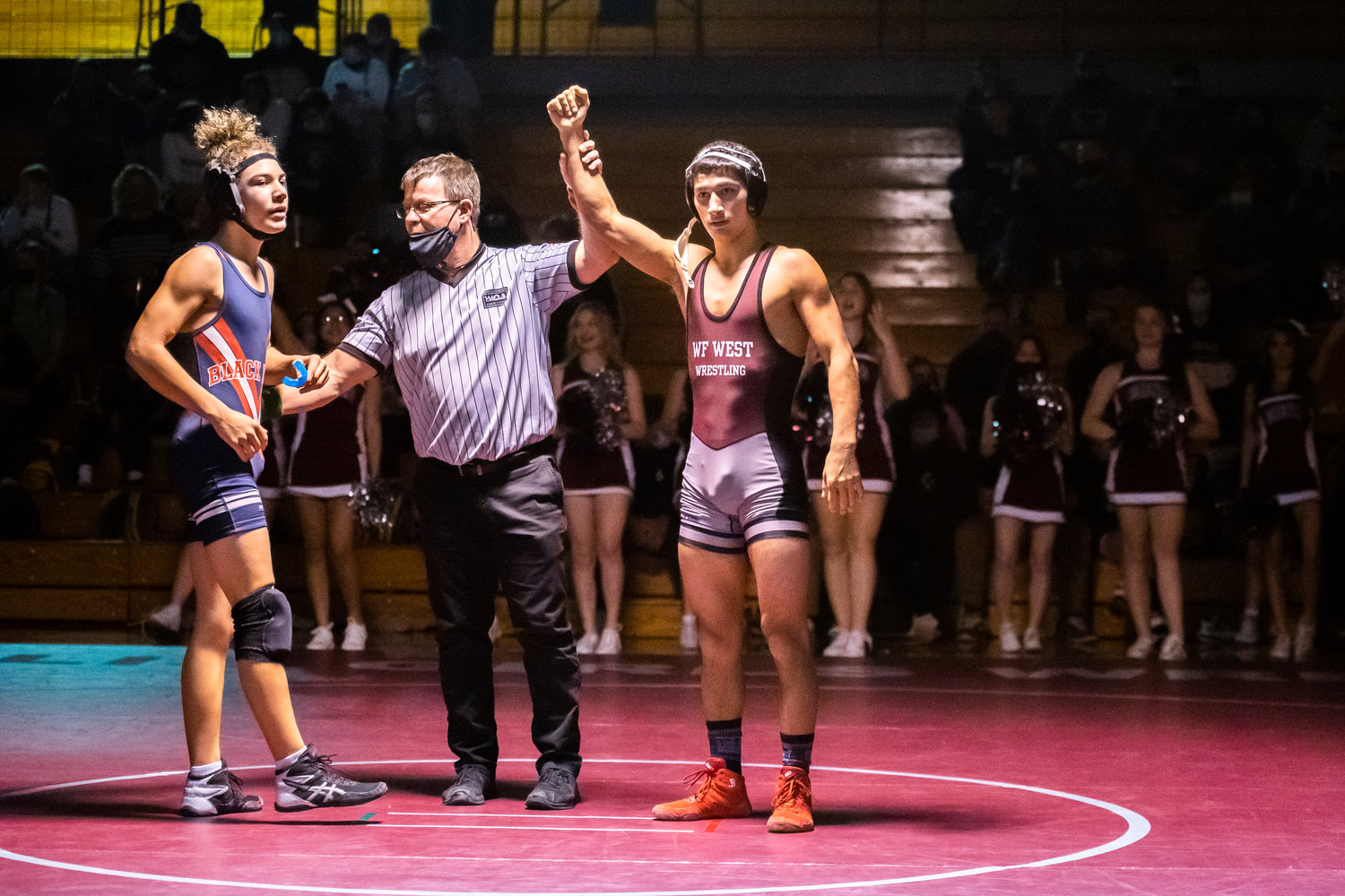 W.F. West Senior Bo Davis has his hand raised after defeating an opponent from Black Hills while wrestling at 138 Thursday night in Chehalis.