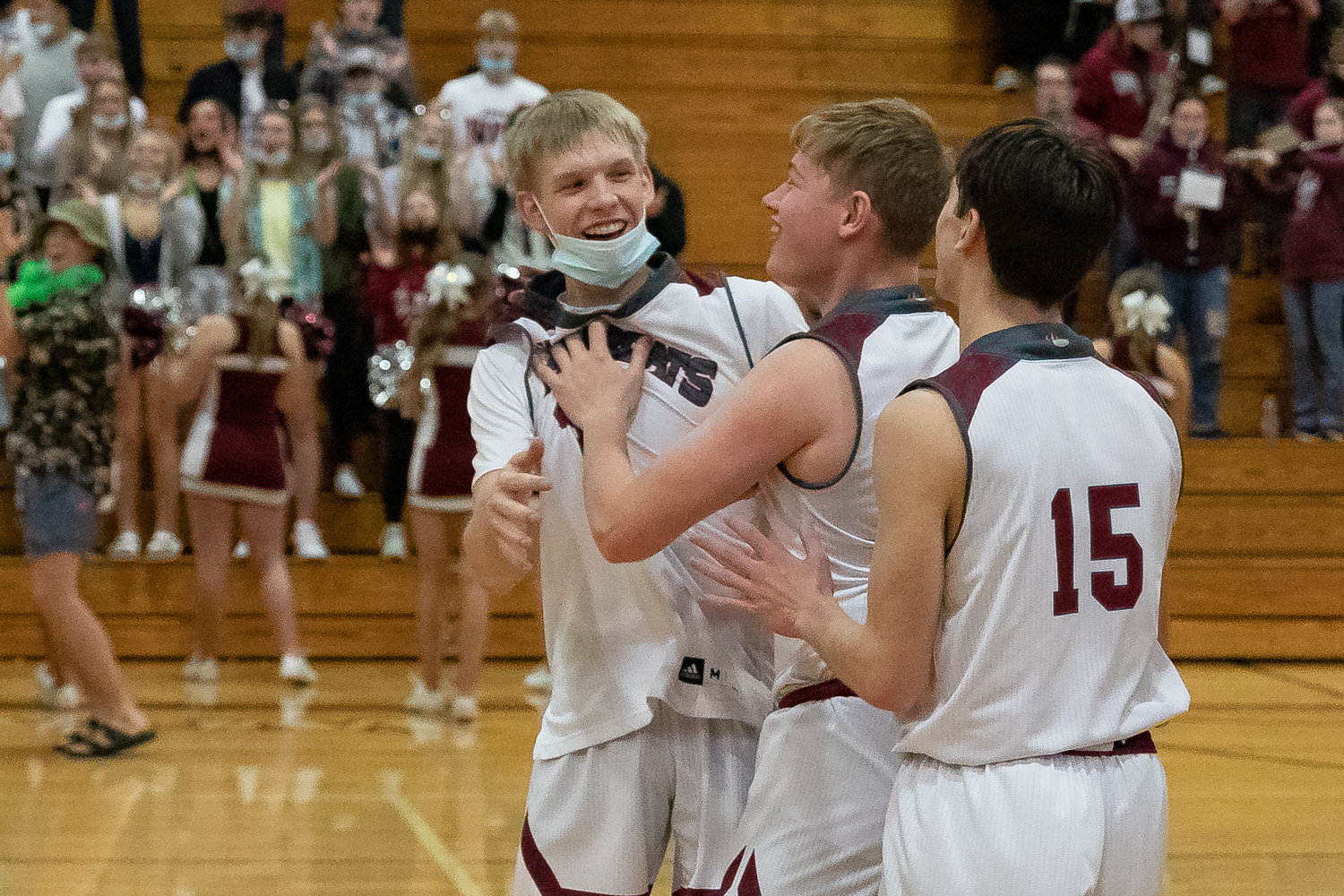 W.F. West guard Evan Tornow (left) celebrates with his teammates after defeating Tumwater Jan. 25.