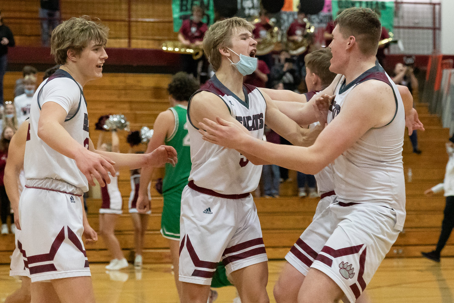 W.F. West's Dirk Plakinger and Soren Dalan embrace after defeating Tumwater in Chehalis Jan. 25.