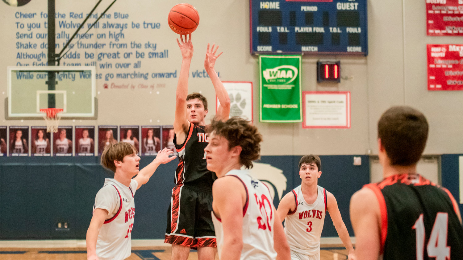 Centralia’s Landon Kaut (12) puts up as shot during a game at Black Hills High School Tuesday night.