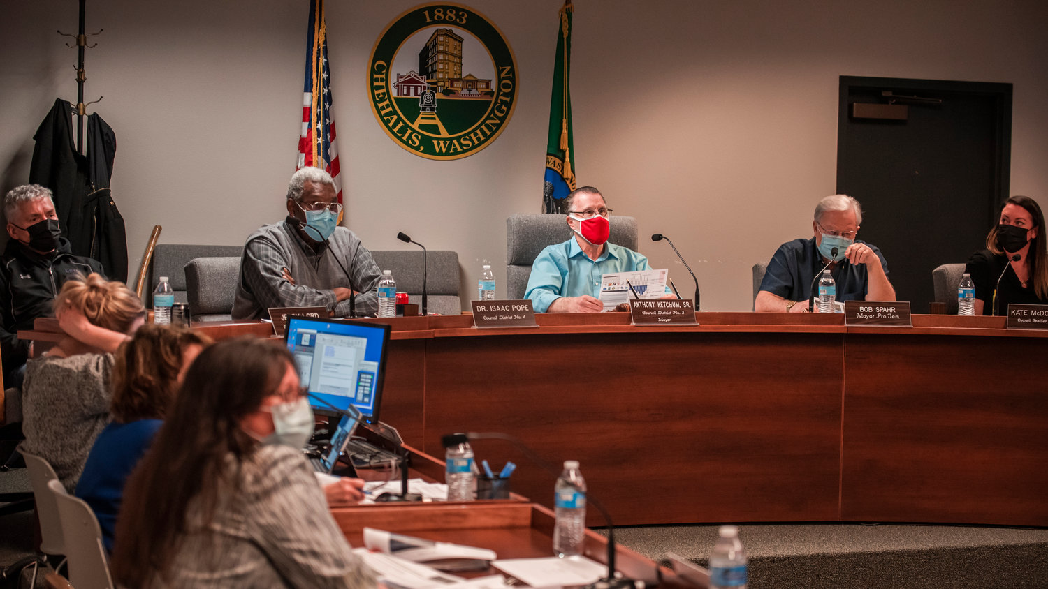 Chehalis City Council members discuss flood waters and listen to speakers during a public meeting Monday evening.
