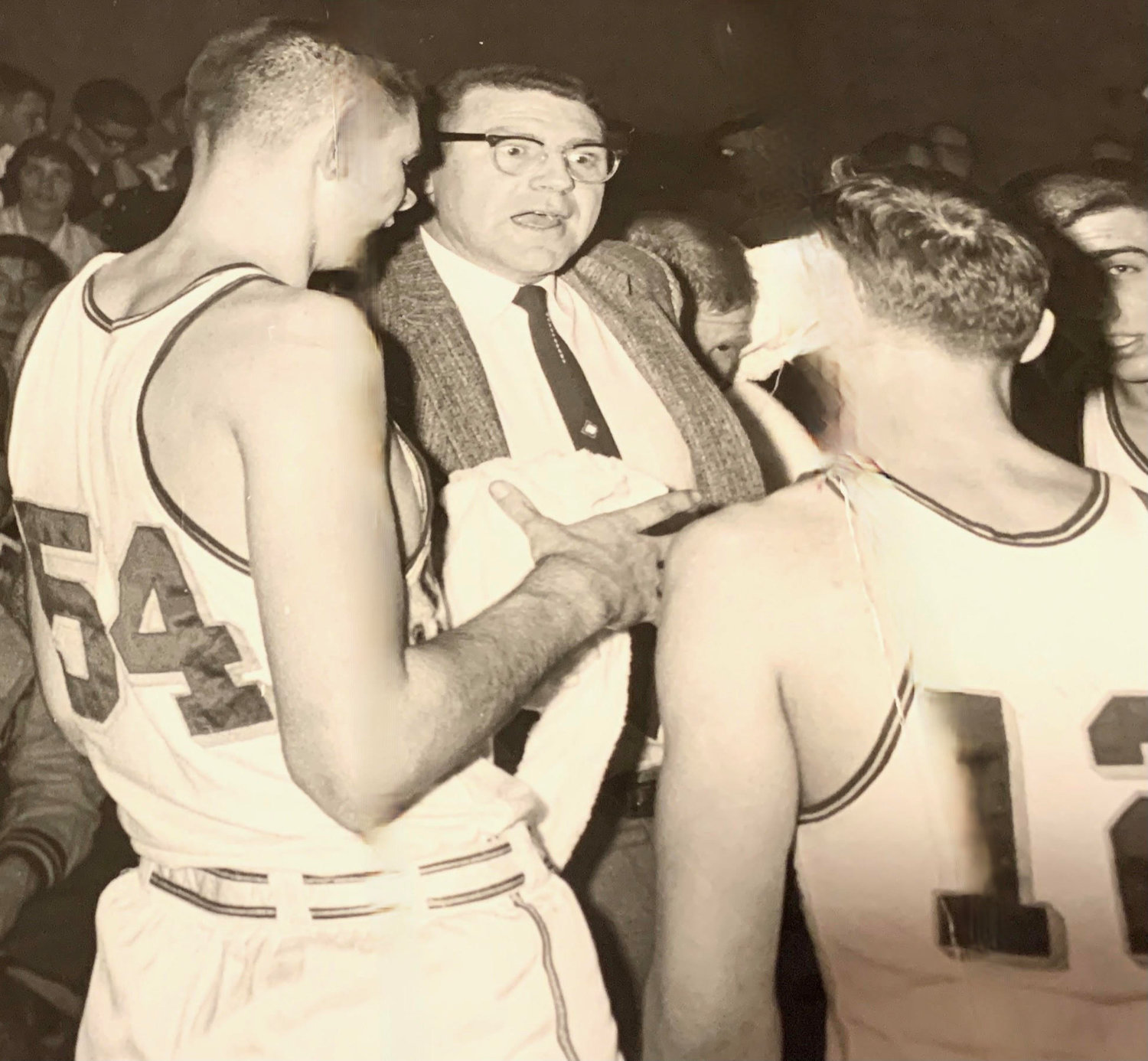 Former W.F. West boys basketball coach Tom Smith talks with his team in a timeout during the Bearcats’ 1960 state championship season.