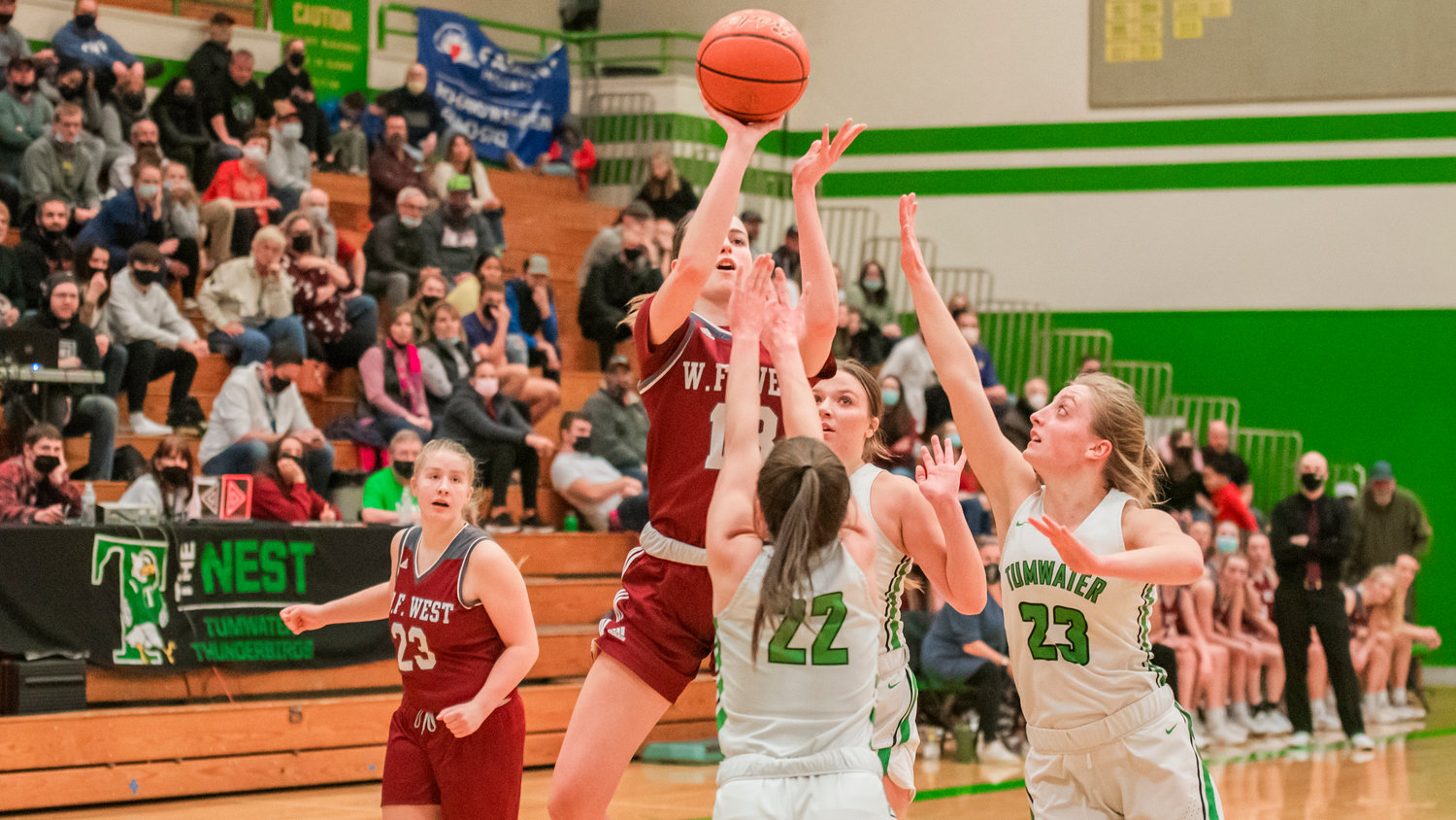 W.F. West’s Drea Brumfield (13) shoots over Tumwater defenders Wednesday night during a game.