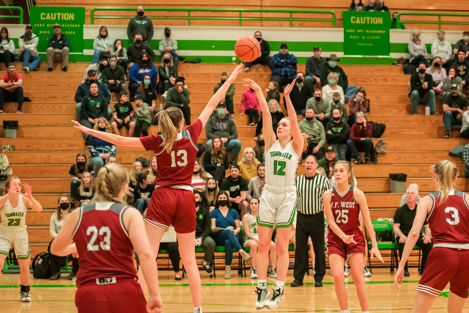 Tumwater’s Aubrey Amendala (12) puts up a shot Wednesday during a game against W.F. West.