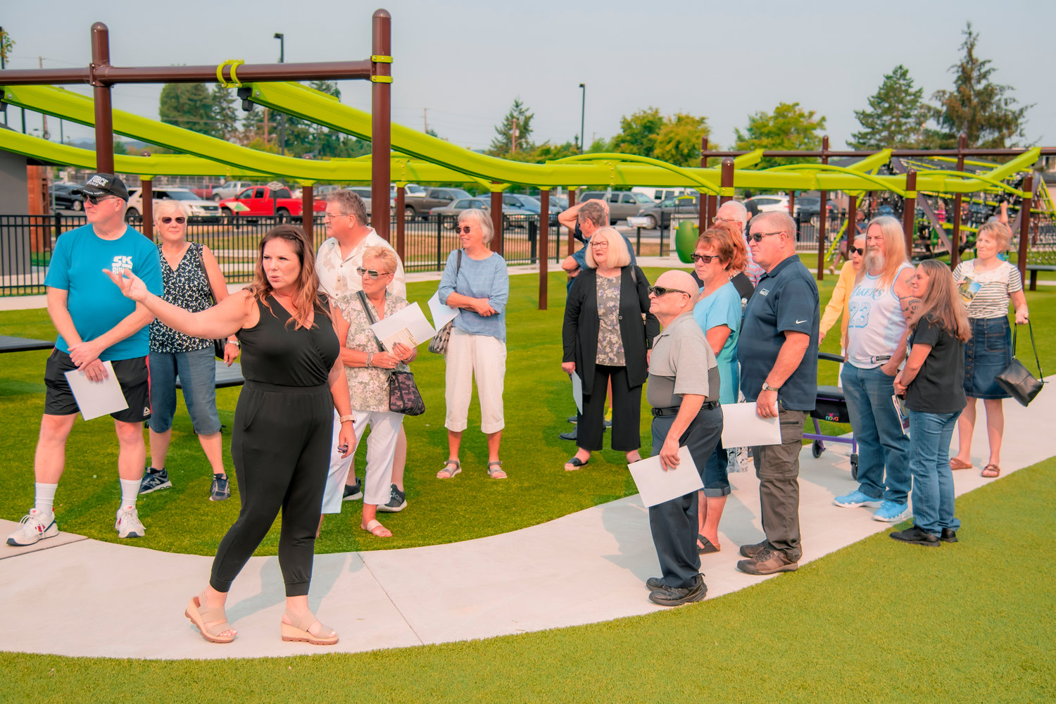 Jenny Collins takes 1971 graduates from W.F. West on a tour of the new Penny Playground during a class reunion in Chehalis.
