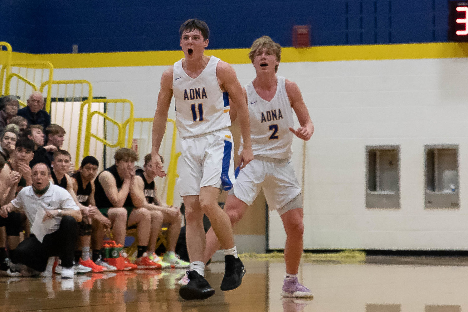 Adna guard Chase Collins (11) yells after Lane Johnson's (2) 3-pointer in the second half against MWP Jan. 28.