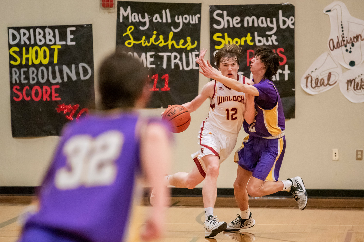 Winlock’s Chase Scofield (12) dribbles the ball as Loggers defend Friday night during a game.