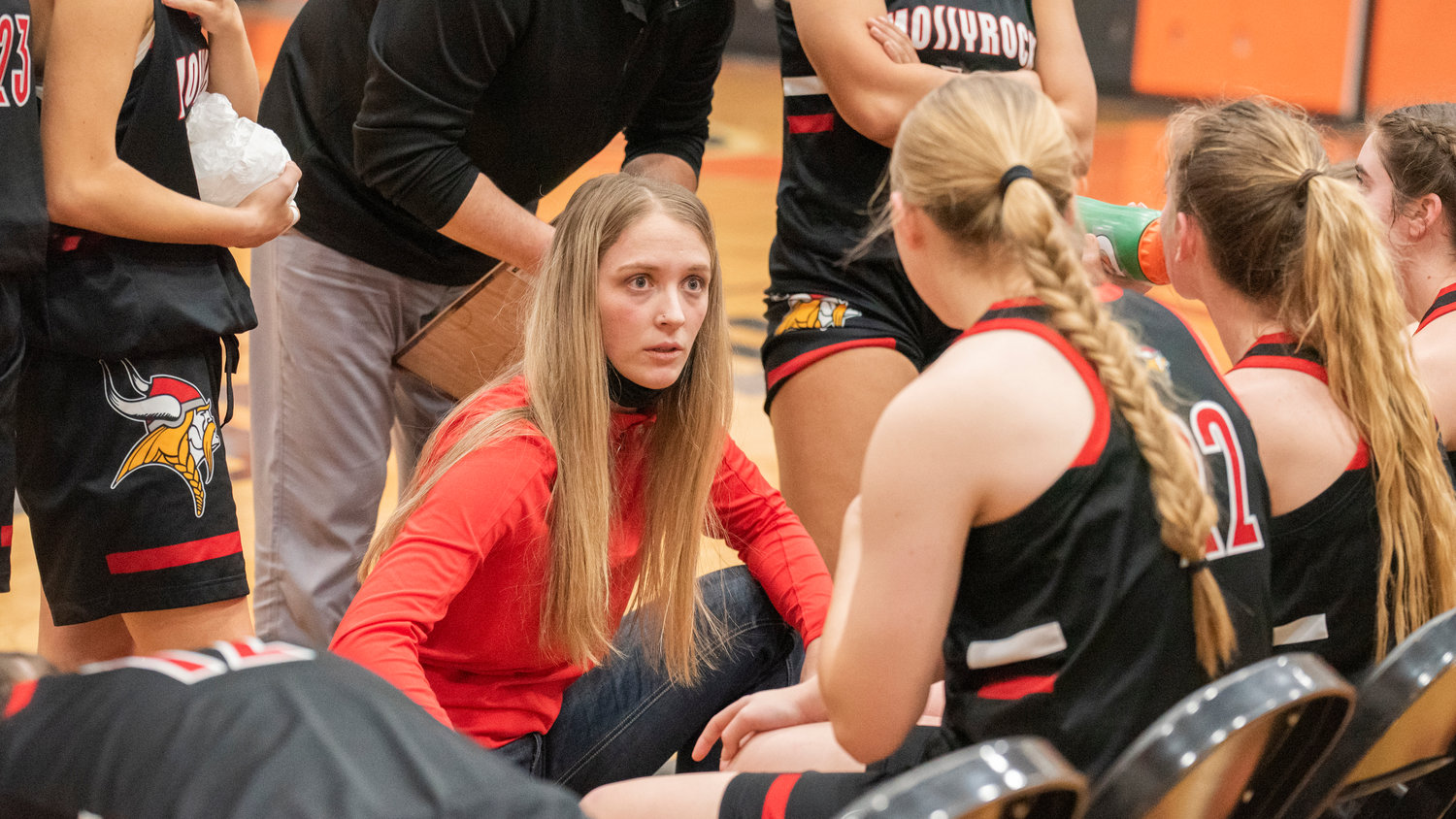 Mossyrock Head Coach Autumn Moorcroft talks to athletes courtside during a game in Rainier Saturday night.