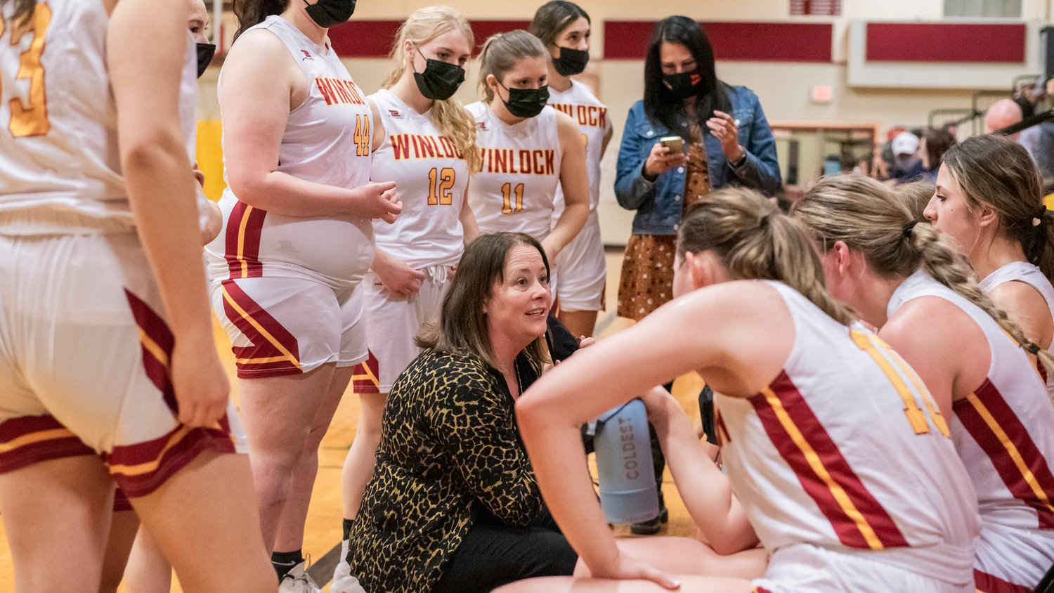 Winlock Head Coach Dracy McCoy talks to athletes courtside in Winlock during a game against Rainier Wednesday night.