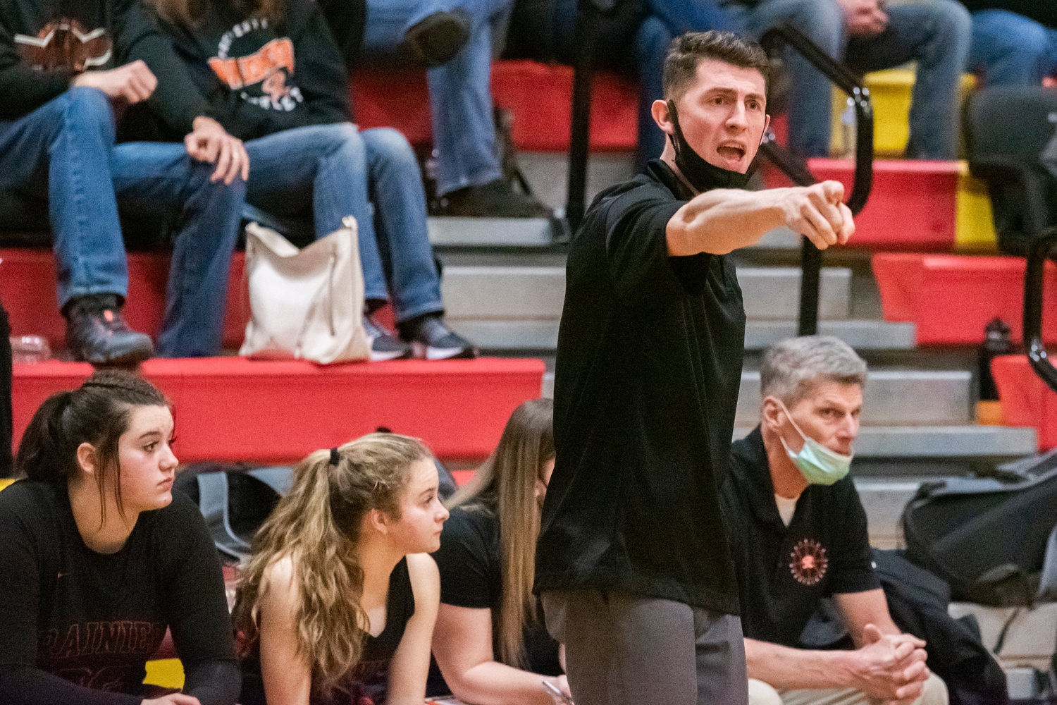 Rainier Head Coach Brandon Eygabroad yells to players on the court during a game Wednesday night in Winlock.
