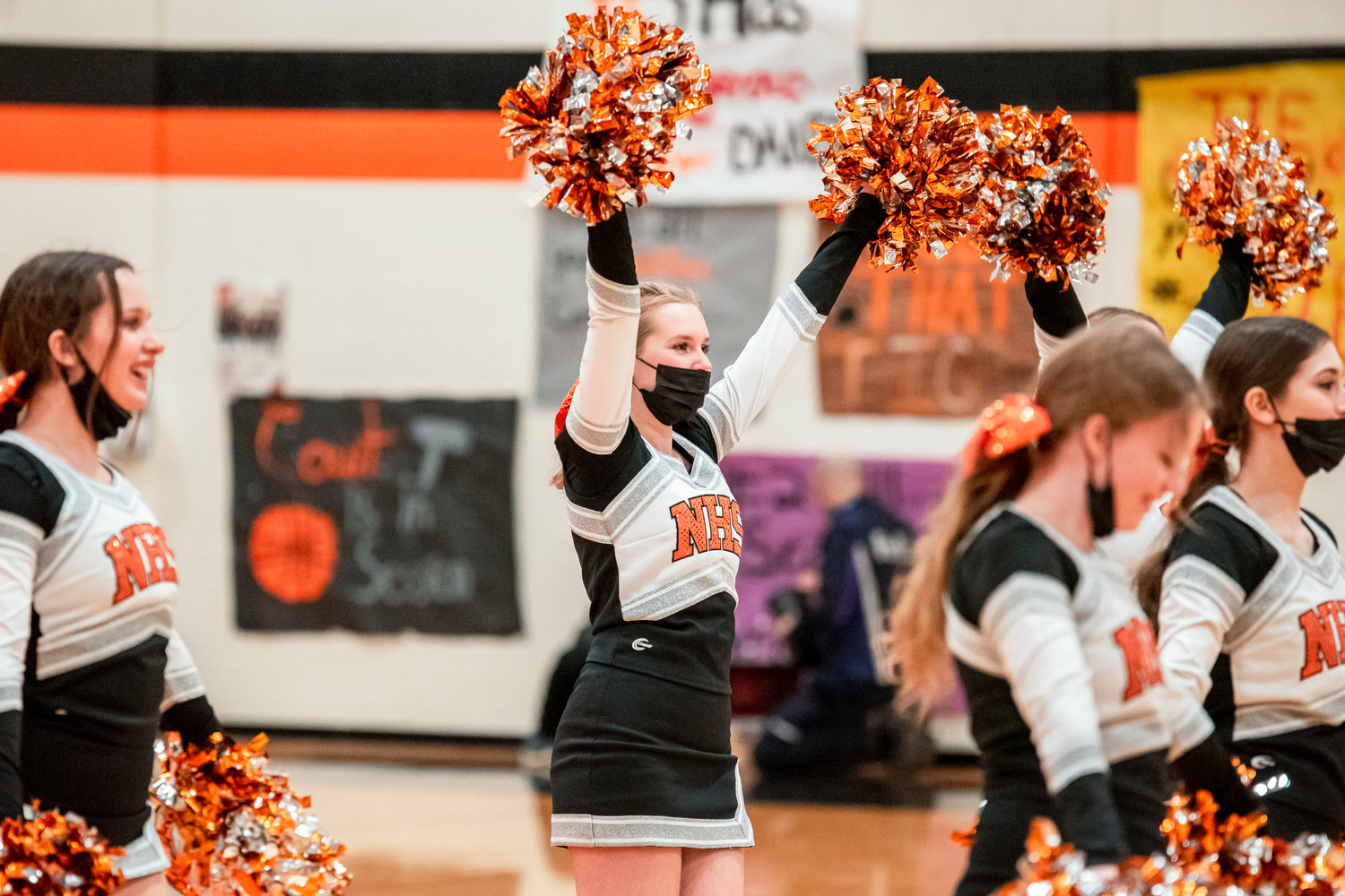 Napavine cheerleaders take the court after a win over Toledo Thursday night.