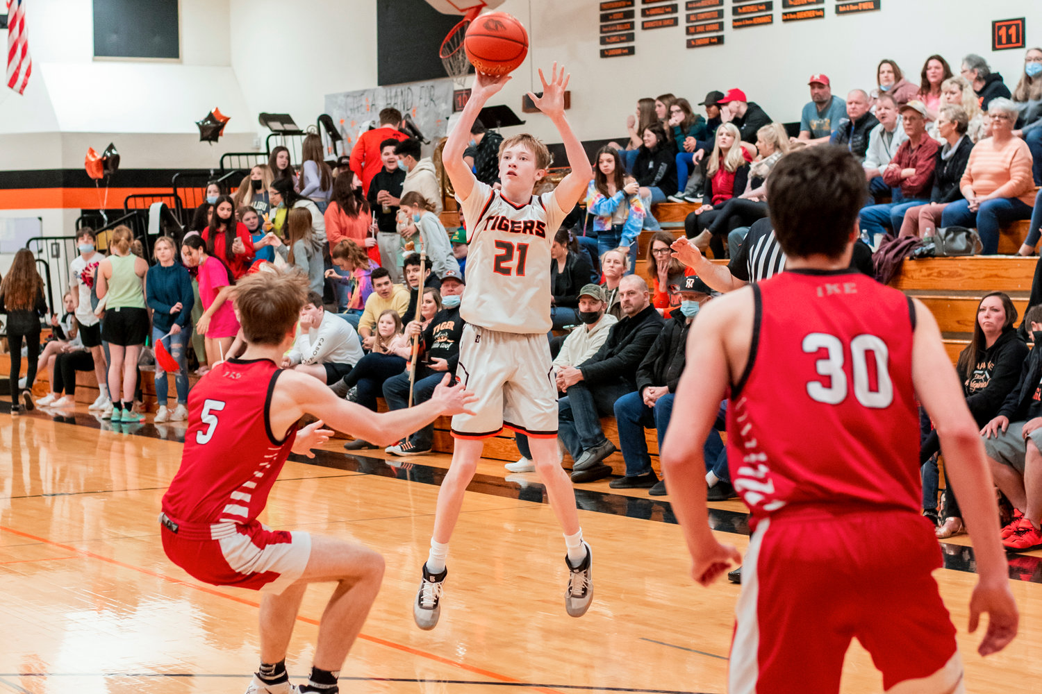 Napavine’s Jarin Prather (21) puts up a shot from behind the three-point line Thursday in Chehalis.