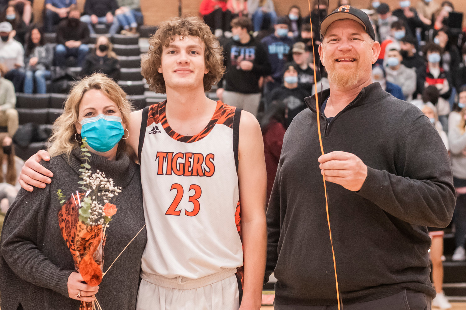 Centralia’s Cole Wasson (23) poses for a photo as he is recognized beside fellow seniors prior to a boys basketball game Friday night.