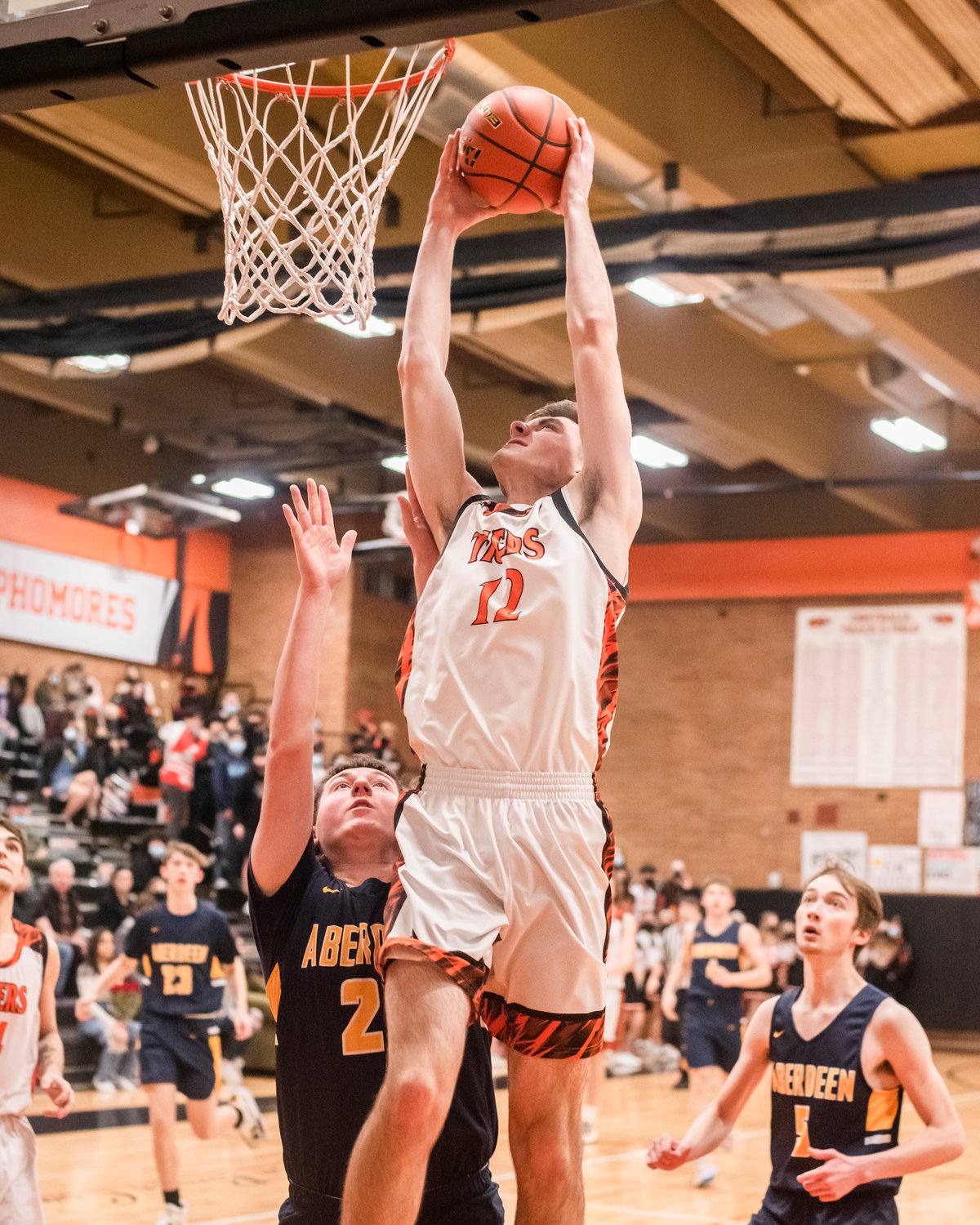 Centralia’s Landon Kaut (12) goes up with the ball Friday night during a game.