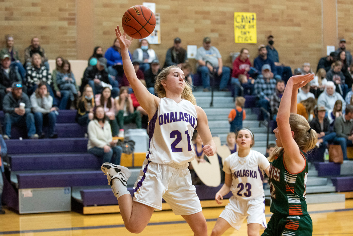 Onalaska's Callie Lawrence (21) saves a ball from going out of bounds during a playoff game at home against Morton-White Pass on Feb. 5.