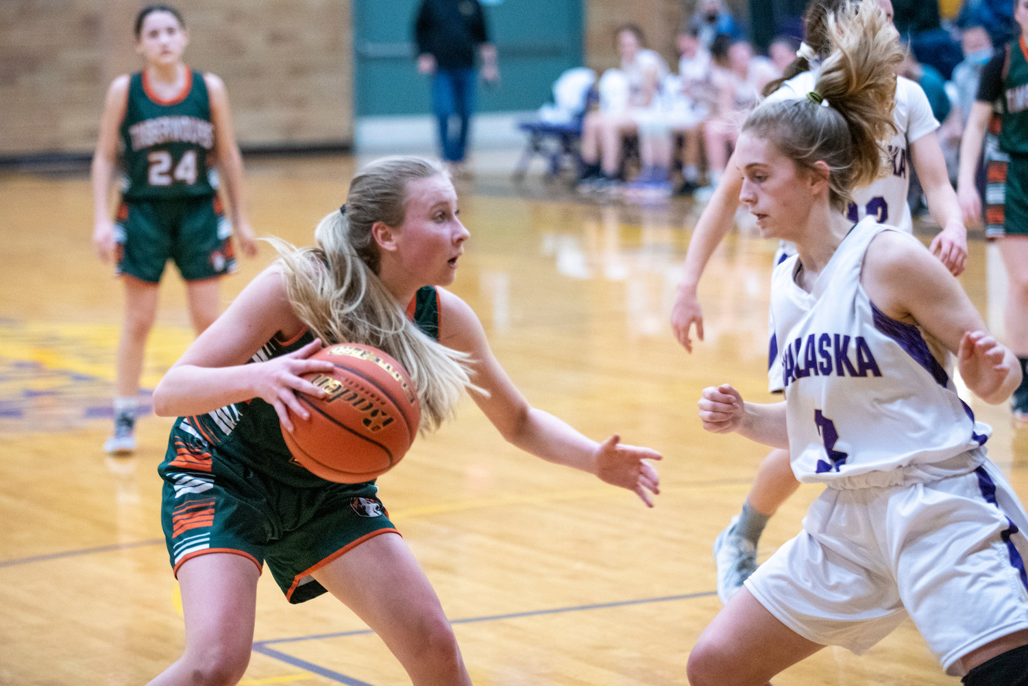 Morton-White Pass' Keira Miller, left, looks for space to operate against the defense of Onalaska's Jaycee Talley on Feb. 5.