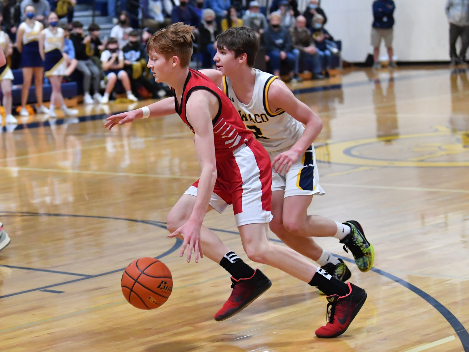 Toledo sophomore Jake Cournyer drives against Ilwaco during the first round of the district playoffs in Ilwaco on Feb. 5.